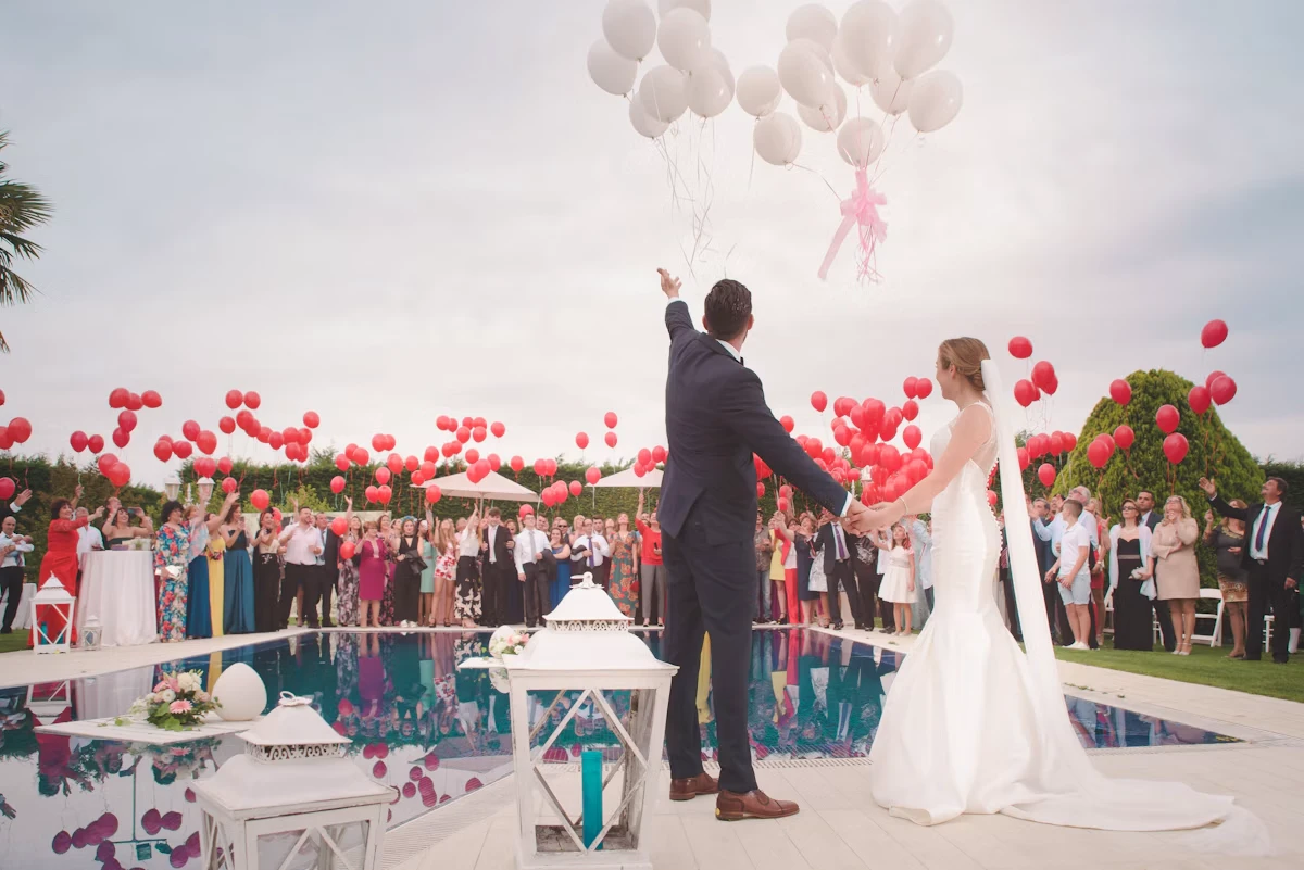 An intimate outdoor wedding celebration beneath a canopy of trees
